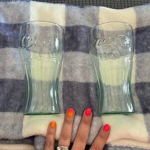 Pair of Coca Cola glasses .